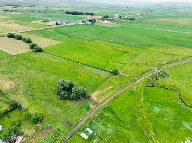 Overview of rural landscape featuring large plots for crops