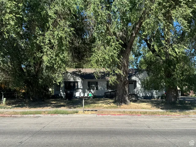 View of front of property with a front lawn