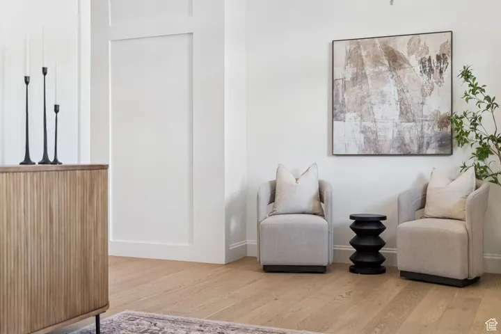 Living area with light wood-type flooring and baseboards