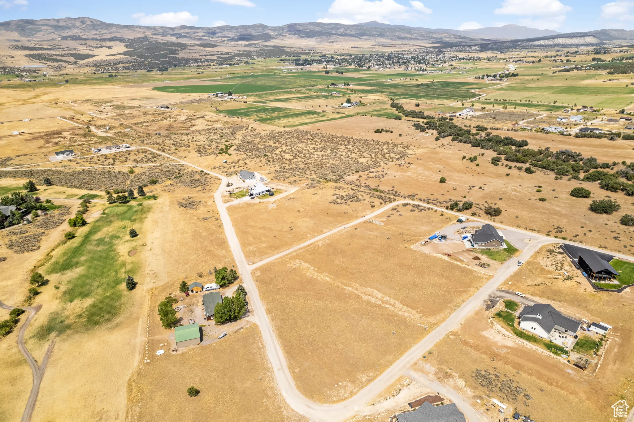 Overview of rural landscape with a mountainous background