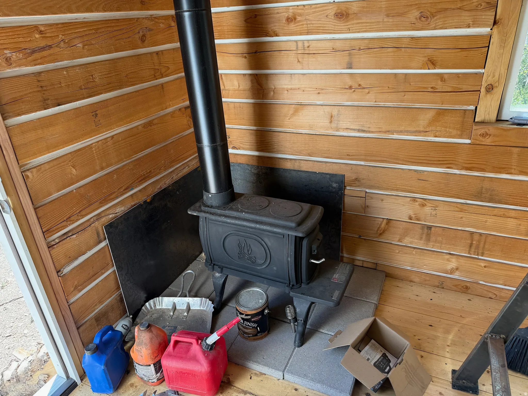 Detailed view of a wood stove and wood walls