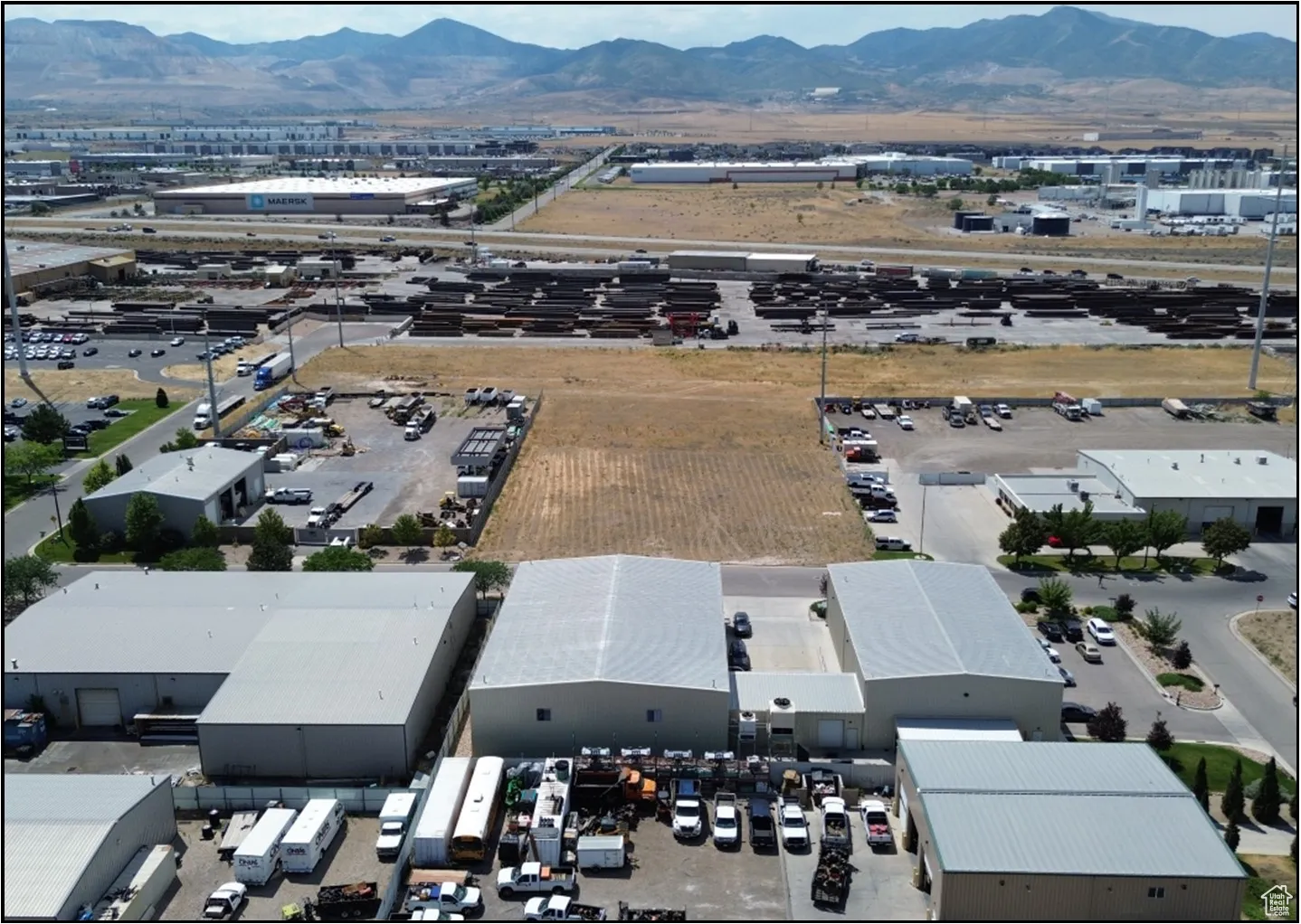 Bird's eye view of an industrial area and a mountain backdrop