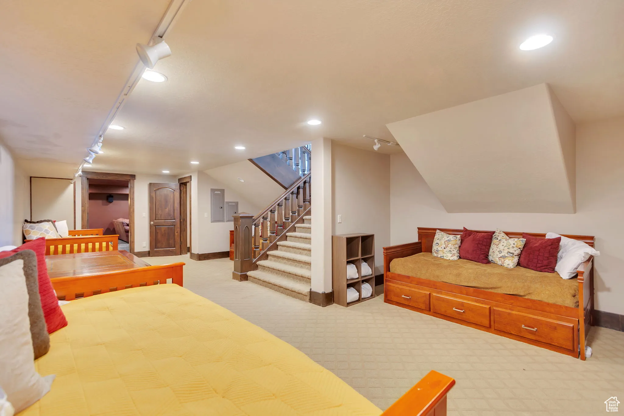 Family room/Bedroom featuring carpet floors, recessed lighting, and electric panel
