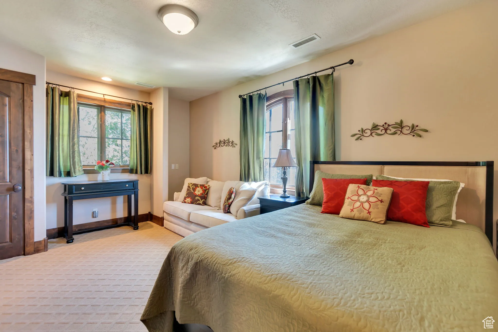 Carpeted bedroom featuring baseboards