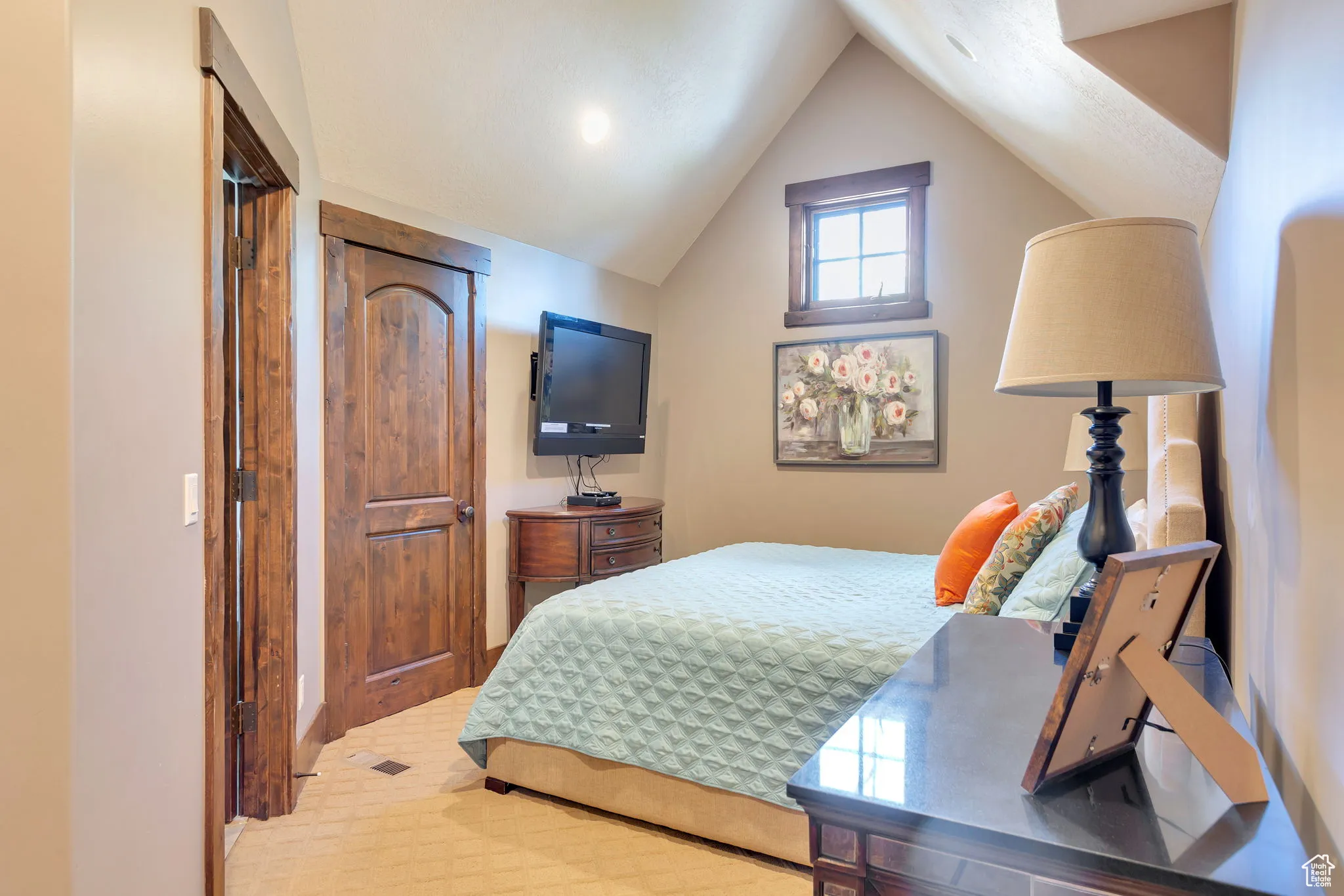 Bedroom with vaulted ceiling