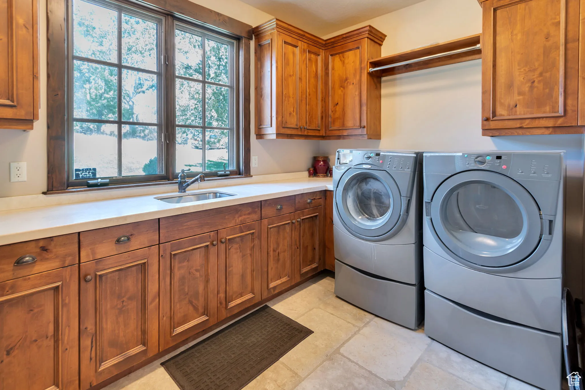 Laundry room with cabinet space and independent washer and dryer