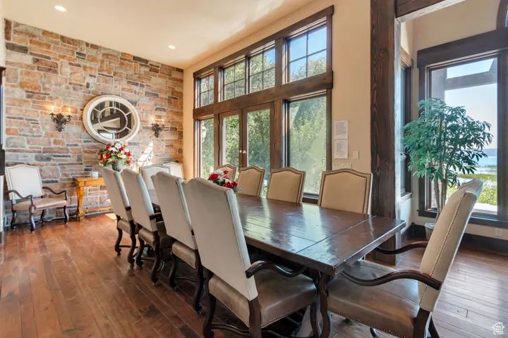 Dining space featuring hardwood / wood-style floors, french doors, and recessed lighting
