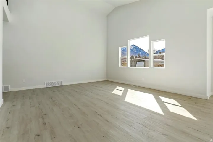 High Vaulted Ceiling in Great Room with Lots of Space to Entertain.