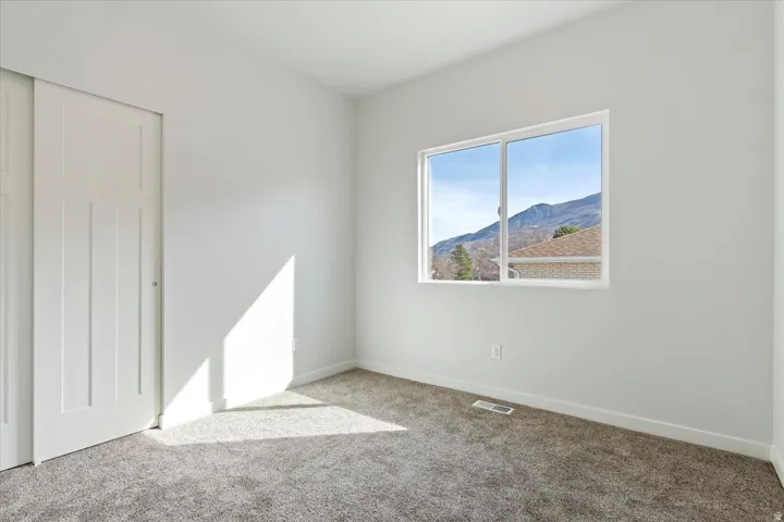 2nd Bedroom with Great Views Through Window.  Large Double Door Closet.