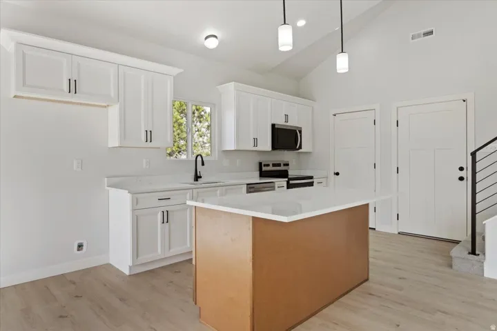 Plenty of Cabinets and Pantry in this Beautiful Kitchen.  Garage Door Entry.