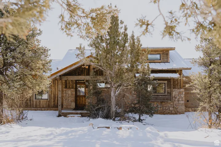 View of front of house featuring stone siding