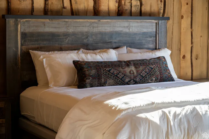 Bedroom with wooden walls