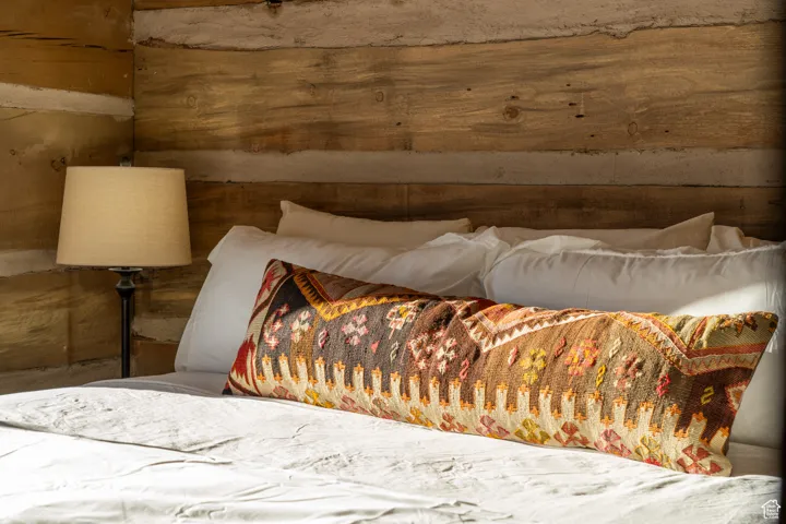 Bedroom with wooden walls