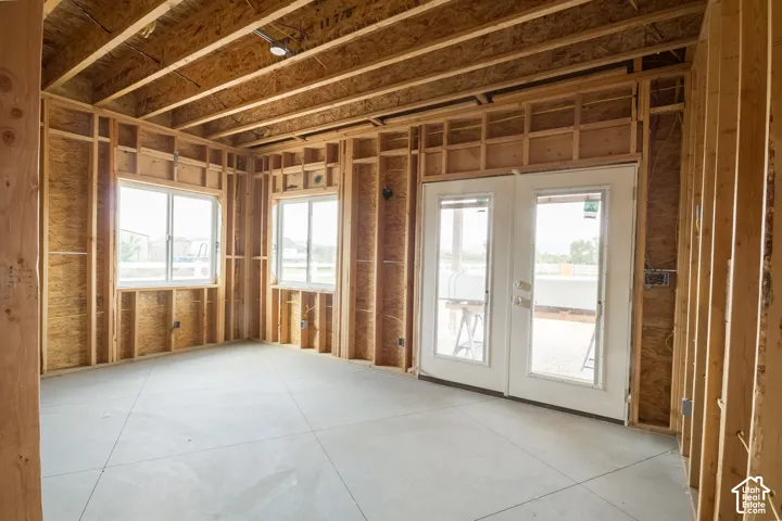 Master Bedroom on main level with walkout doors to back covered patio