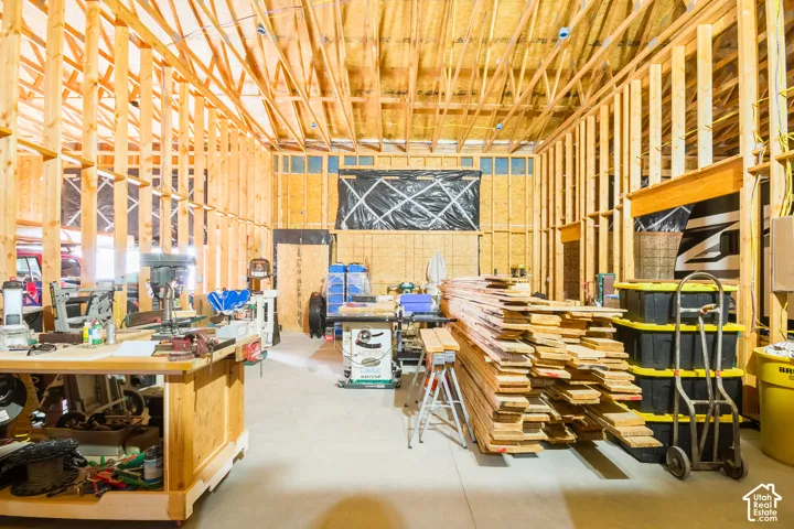 Second bay in shop wired for a woodworking shop. Balcony above for additional storage & work room to store tools not shown.