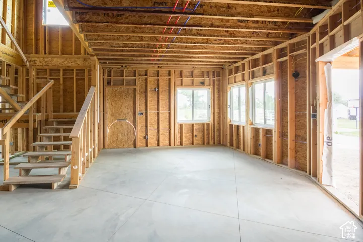 Front door into downstairs living room and stair case