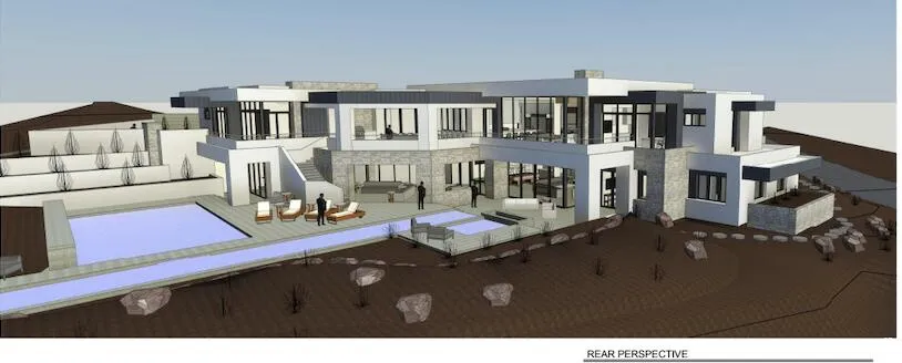 Rear view of house with stucco siding and a patio