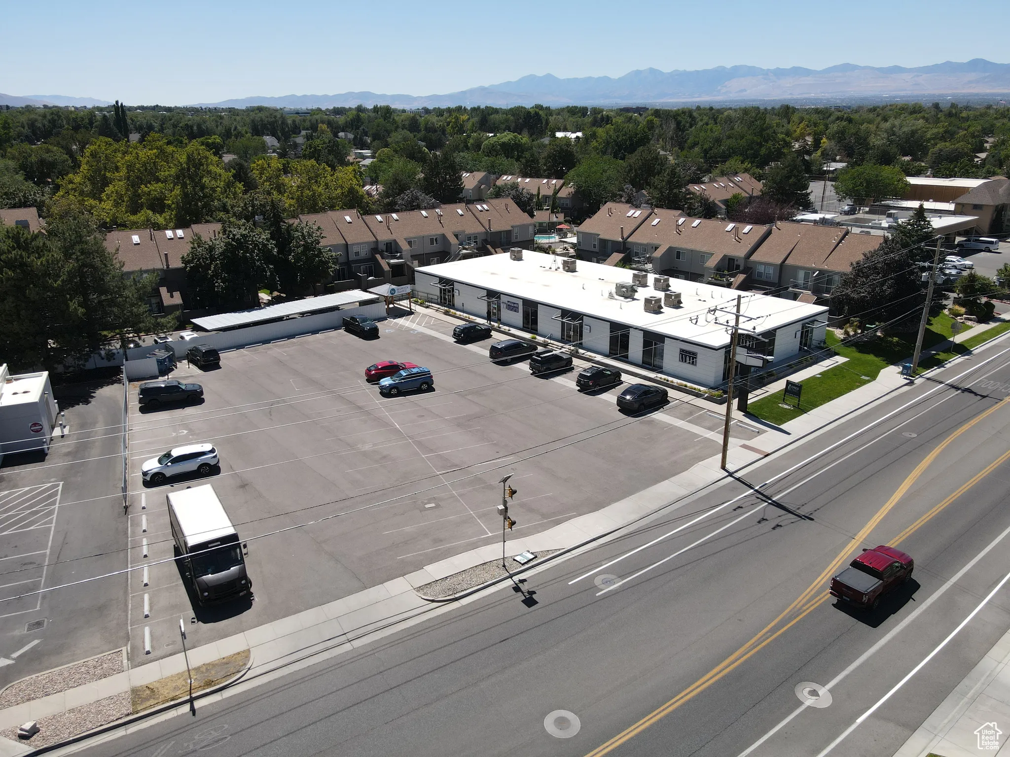 Aerial view of residential area featuring a mountain backdrop