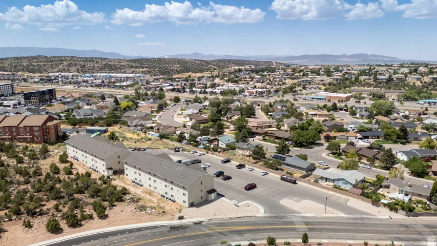 Aerial view of residential area featuring mountains