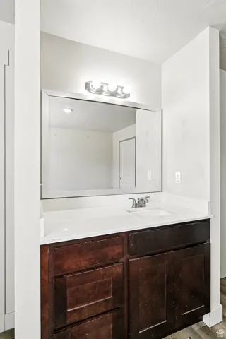 Bathroom with vanity and light wood-type flooring