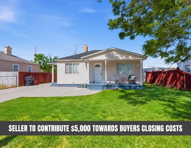 Ranch-style residence featuring light-toned siding, a covered front porch, and a well-maintained lawn