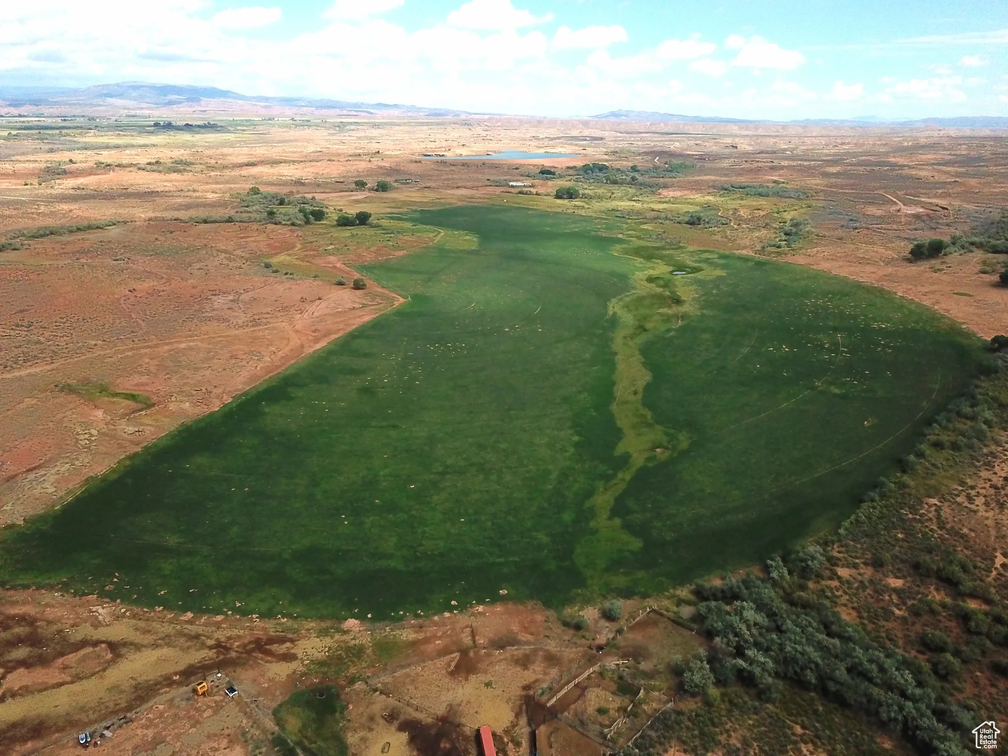 Aerial view of property and surrounding area with mountains and rural landscape