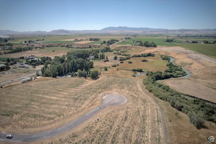 Aerial view of sparsely populated area with a mountain backdrop