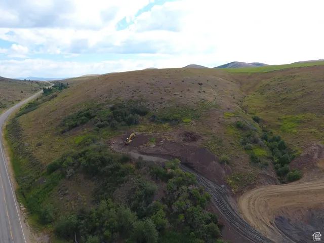 Aerial overview of property's location with a mountain backdrop