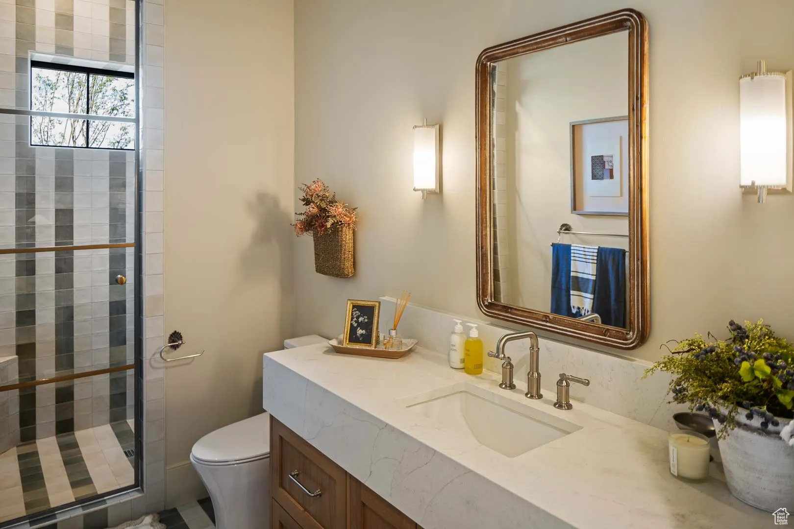 Bathroom featuring vanity and a shower stall