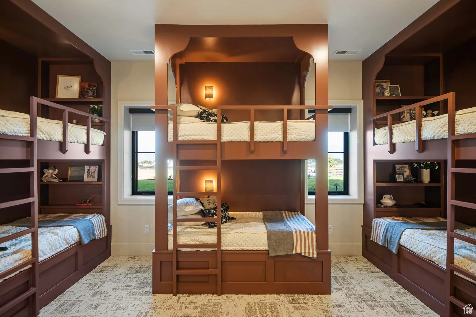 Bedroom with light colored carpet and baseboards
