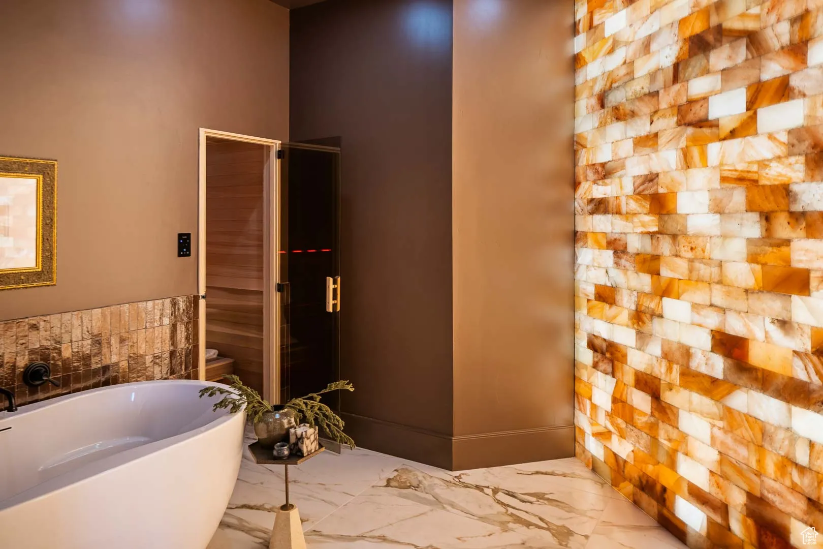 Full bath featuring a bath, marble finish flooring, a stall shower, and a relaxing sauna