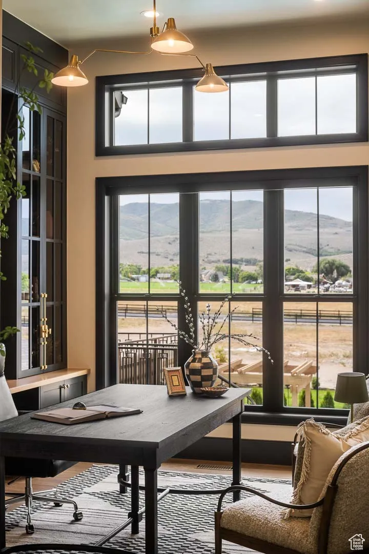 Sunroom with a mountain view and plenty of natural light