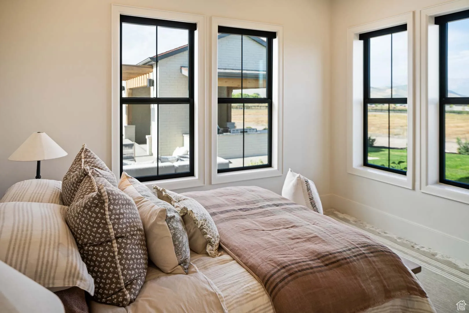 Bedroom featuring multiple windows
