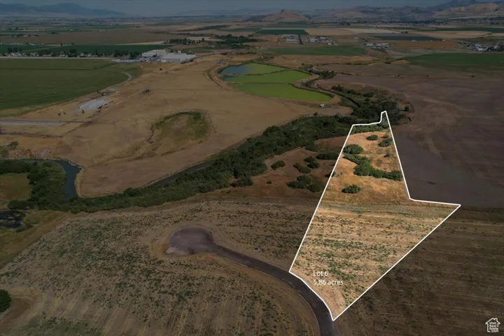 View of property location with rural landscape, property parcel outlined, and a mountainous background