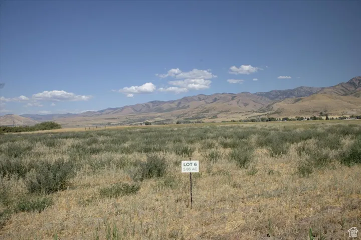 View of mountain backdrop with rural landscape