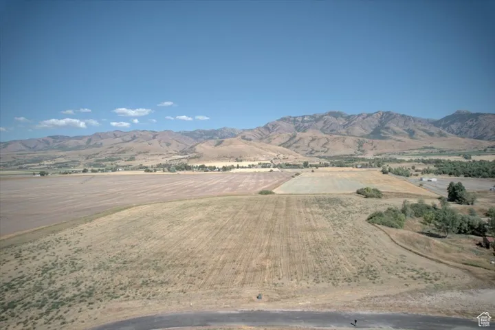 View of mountain backdrop featuring rural landscape