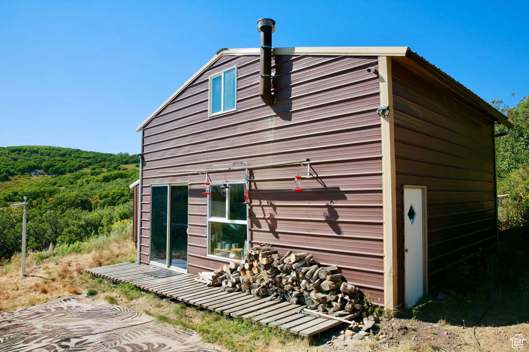 View of outdoor structure with a wooded view