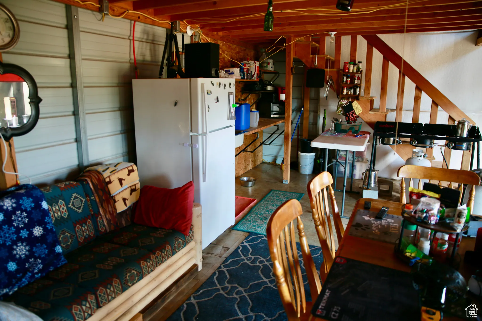 Garage featuring freestanding refrigerator