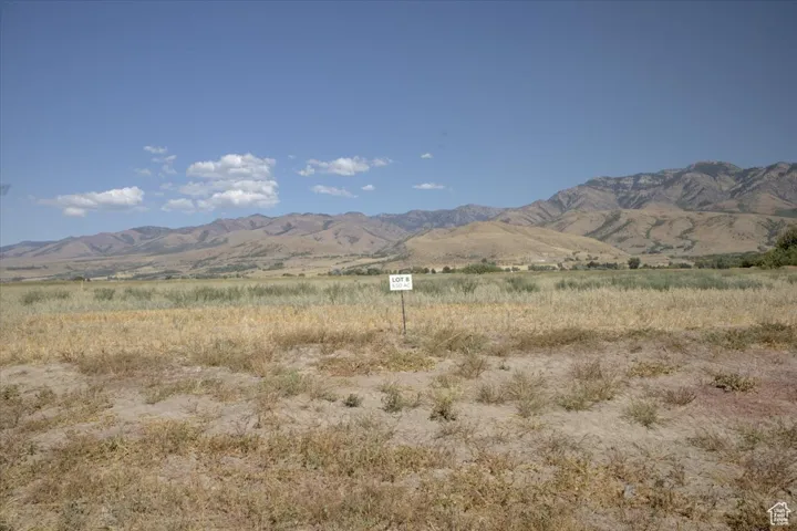 View of mountain backdrop with rural landscape
