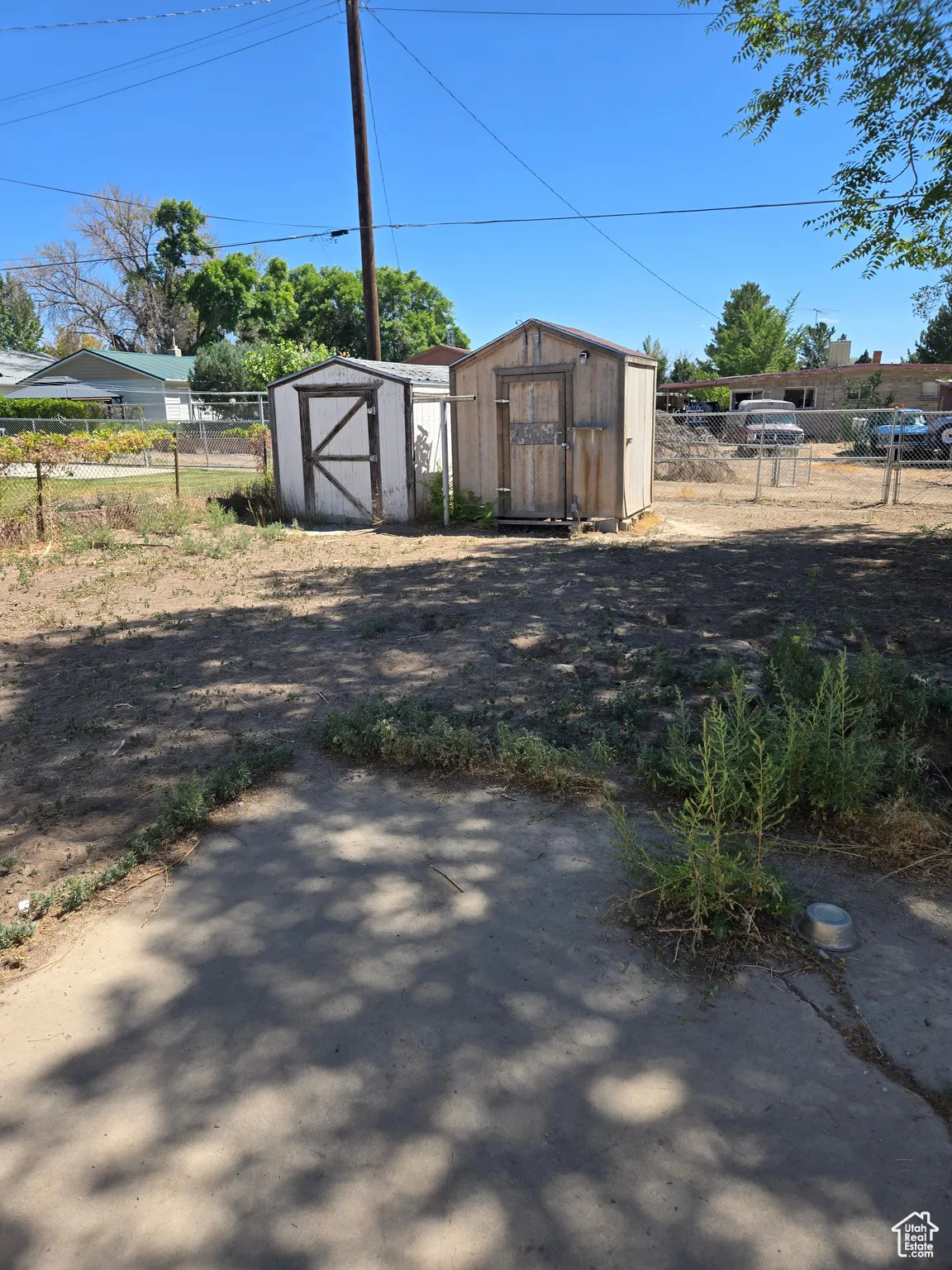 View of yard featuring a storage unit