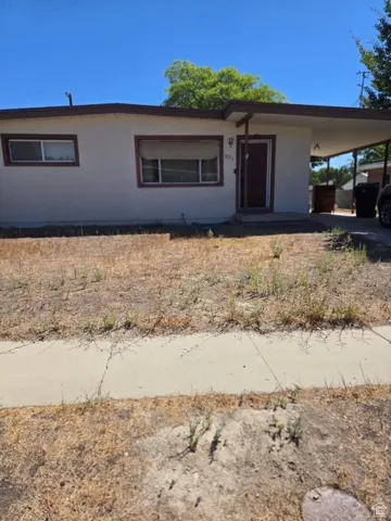 Ranch-style house with an attached carport