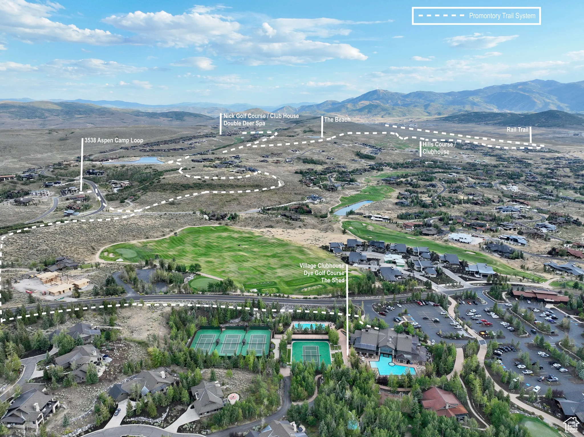 Aerial view of property's location featuring mountains and a pool