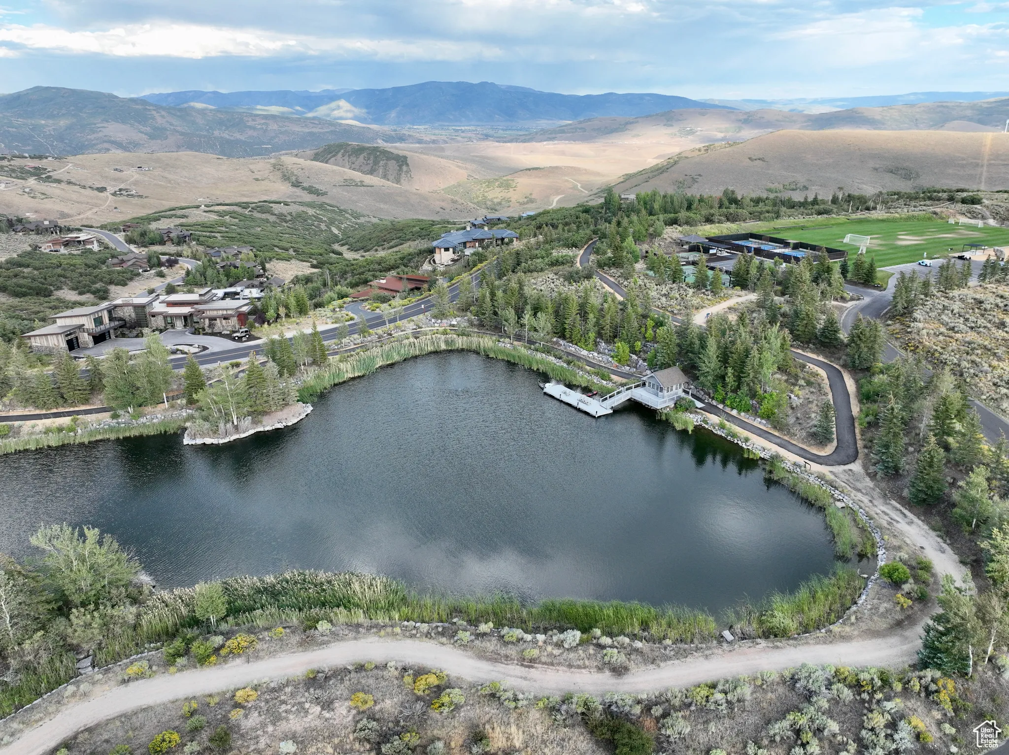 View of property location featuring a water and mountain view