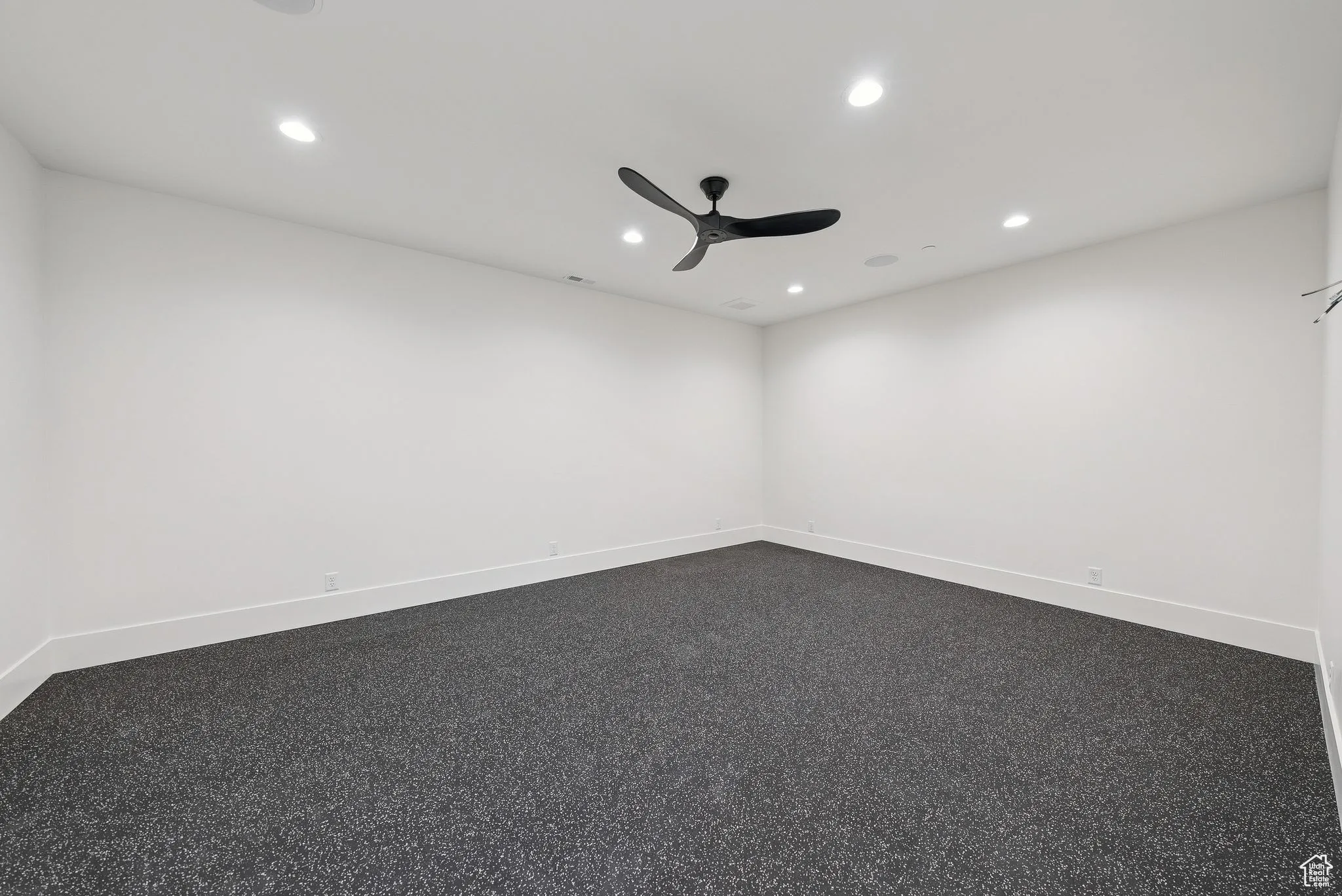 Empty room with recessed lighting and ceiling fan