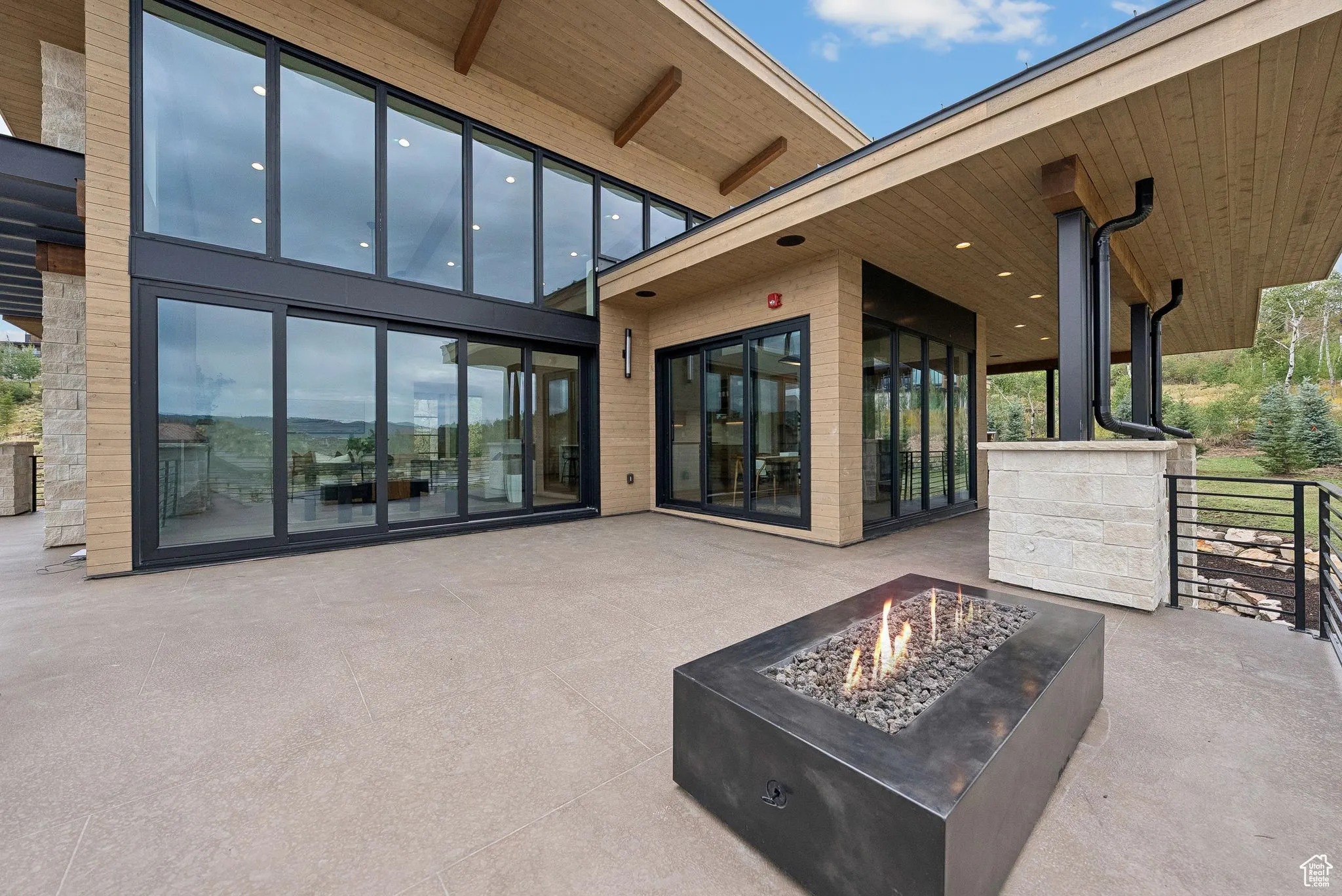 View of patio featuring a fire pit