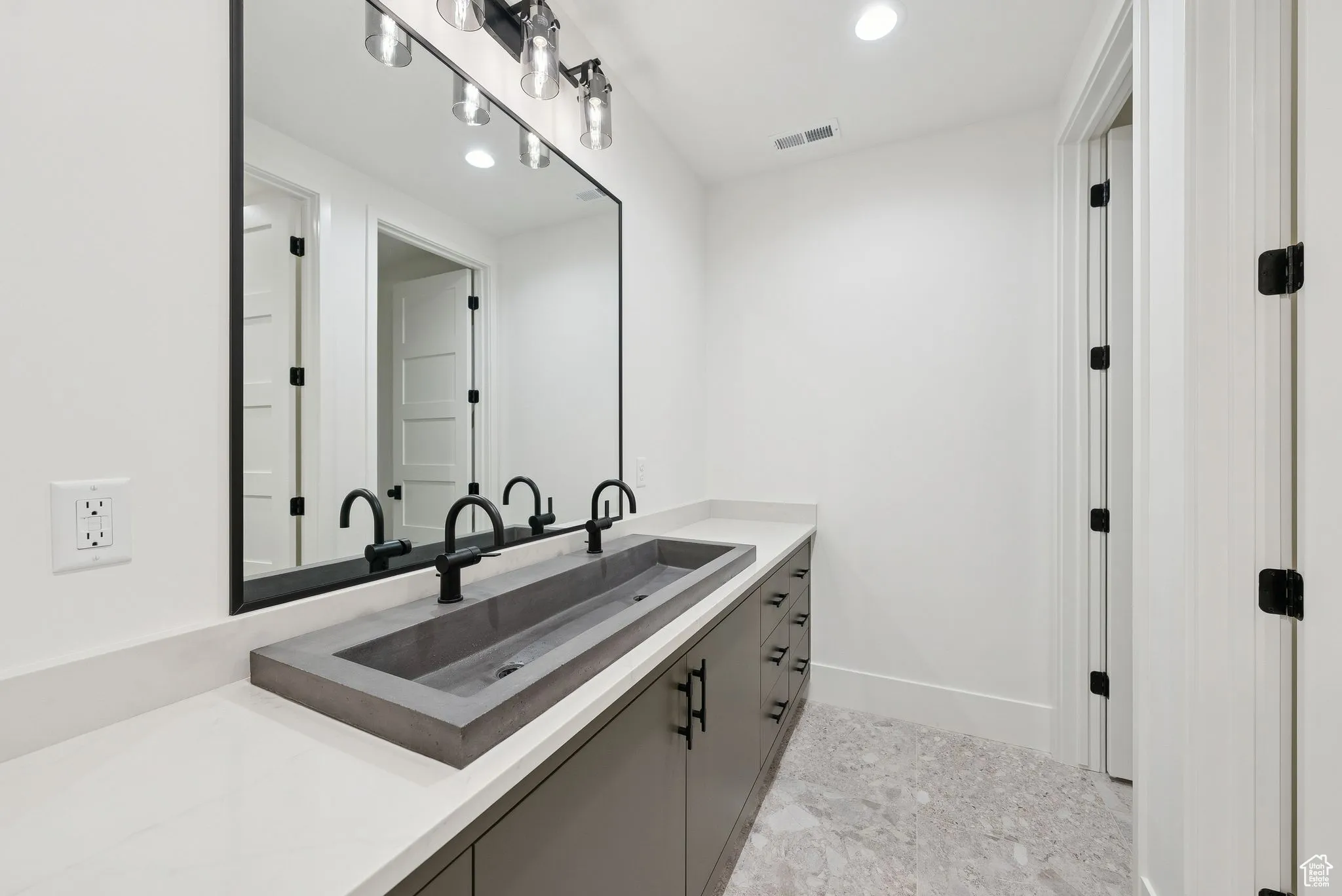 Bathroom featuring vanity and recessed lighting