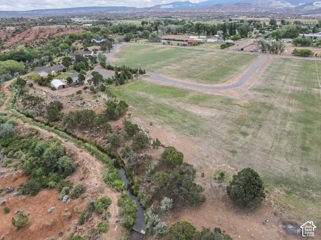 Aerial overview of property's location featuring rural landscape and mountains