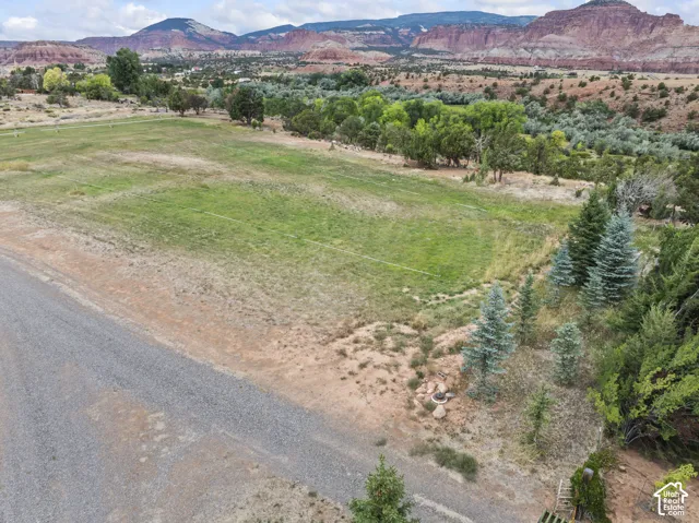 Aerial view of sparsely populated area featuring a mountainous background