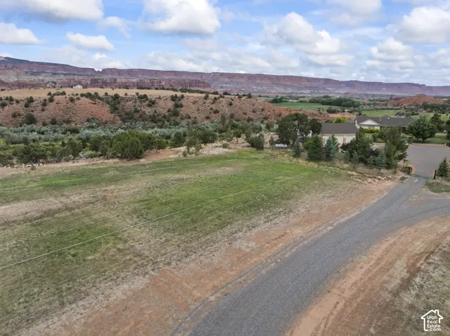 View of mountain backdrop with rural landscape