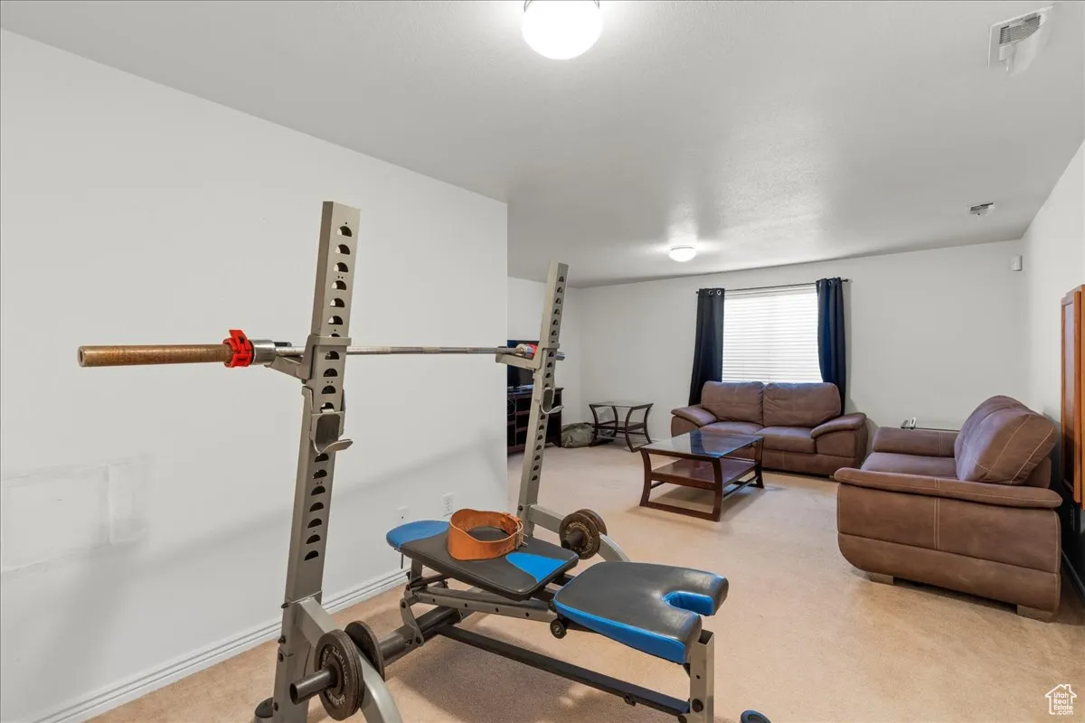 Exercise room with light carpet